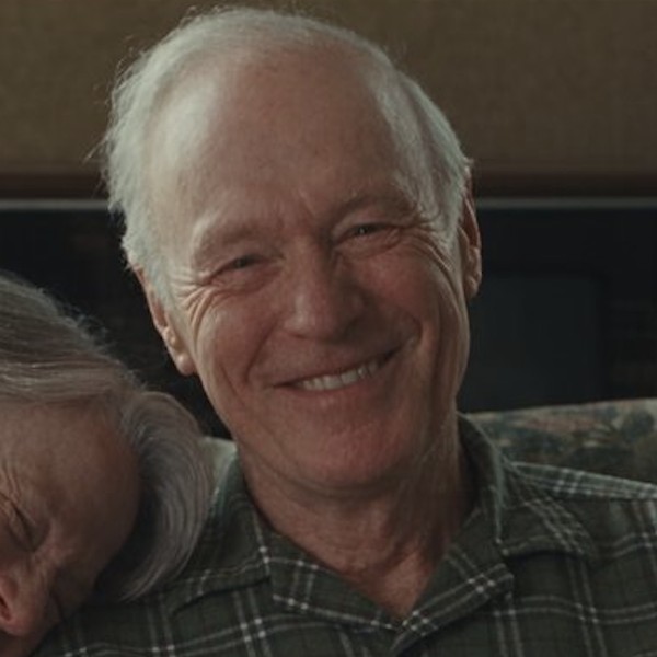 An older man smiling