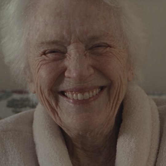 An older woman laughing